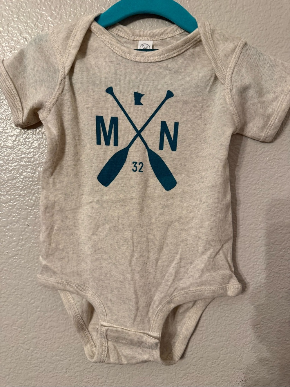 Rabbit Skins Cream One-Piece with Teal Oar Minnesota Graphic
